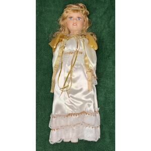 Porcelain Angel doll in lace gown with gold trim and wings 17”